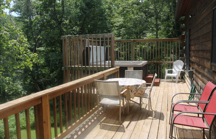 back deck, hot tub, tables and chairs