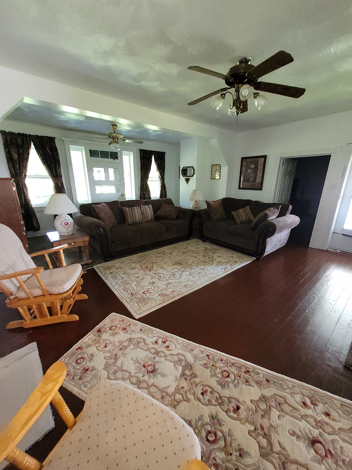 living room, wood floor, floral print rugs