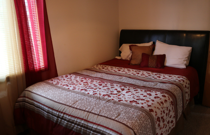 bedroom, red bedding